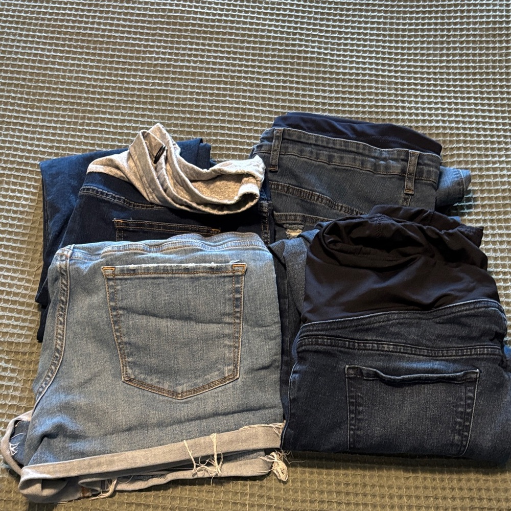 Assorted maternity jeans and shorts.